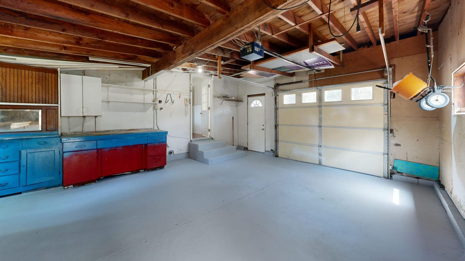 Garage interior with a smooth gray coated concrete floor