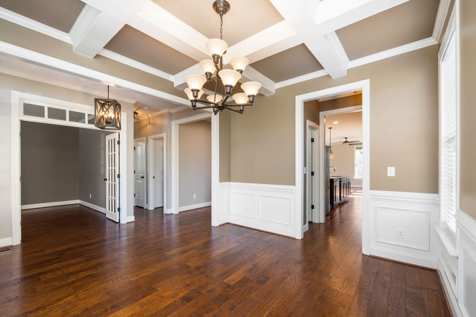 Clean, refreshed interior with hardwood floors and a coffered ceiling, ready for the next resident